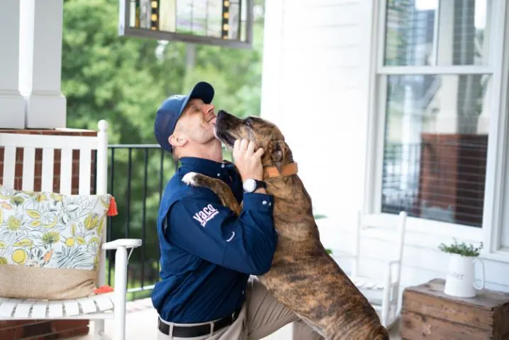 VACO Pest technician with dog